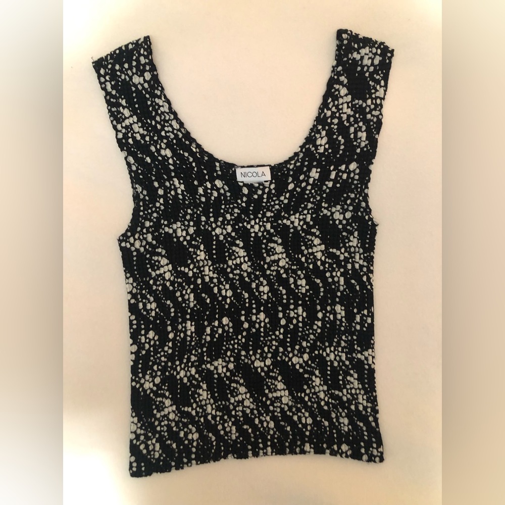 Gently worn. Pet and smoke free home. Tank top. Waist length.